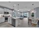 Spacious kitchen with an island, stainless steel appliances, and an open layout to living areas at 253 Tracino Ter, Nokomis, FL 34275