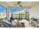 Relaxing screened lanai with comfortable seating and picturesque views of the lake at 253 Tracino Ter, Nokomis, FL 34275