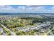 Stunning aerial view of the neighborhood with lush trees and serene ponds at 2538 Fireflag Ln, Sarasota, FL 34232