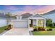 Charming single-story home with manicured lawn, tasteful landscaping, and attached garage at 2538 Fireflag Ln, Sarasota, FL 34232