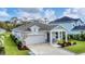 Charming single-story home featuring a two-car garage and manicured lawn at 2538 Fireflag Ln, Sarasota, FL 34232