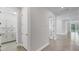 Hallway with tile floors leading to modern rooms at 2538 Fireflag Ln, Sarasota, FL 34232