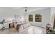 Bright and airy main bedroom with modern decor and lots of natural light at 2538 Fireflag Ln, Sarasota, FL 34232