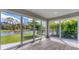 Bright sun room with beautiful water views and access to the outdoor pool at 2538 Fireflag Ln, Sarasota, FL 34232