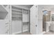 Well-organized walk-in closet with adjustable shelving and ample storage space at 2538 Fireflag Ln, Sarasota, FL 34232