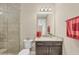 Bathroom with granite countertop, walk-in shower, and new fixtures at 261 Portofino Dr, North Venice, FL 34275