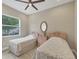 Bright bedroom with tile floors and two beds at 261 Portofino Dr, North Venice, FL 34275