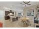 Open dining area with views to the kitchen and living room allows for easy conversation and entertaining at 261 Portofino Dr, North Venice, FL 34275