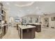 Spacious kitchen boasts an open floor plan with a double island, eating area and views to the living room at 261 Portofino Dr, North Venice, FL 34275
