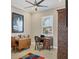 Home office featuring natural lighting, neutral walls, a ceiling fan, and a wooden desk at 261 Portofino Dr, North Venice, FL 34275