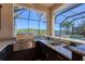 The Outdoor kitchen has stainless steel appliances, granite countertops and a view of the pool at 261 Portofino Dr, North Venice, FL 34275