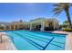 Well-maintained community lap pool with clear blue water and ample seating for residents at 261 Portofino Dr, North Venice, FL 34275