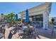 Poolside bar with blue umbrellas and outdoor seating for a relaxing experience at 261 Portofino Dr, North Venice, FL 34275