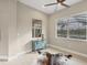 Bright sitting area with tile floors and tranquil outdoor views at 261 Portofino Dr, North Venice, FL 34275