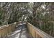 Picturesque walking path winding through a lush, wooded area at 261 Portofino Dr, North Venice, FL 34275