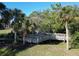 Elevated wooden walkway winds through the lush landscaping, offering scenic views throughout the community at 261 Portofino Dr, North Venice, FL 34275