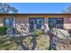 Exterior view of the backyard with a privacy fence, tidy lawn, and access to the home's entrance at 2808 60Th W Ave # 1603, Bradenton, FL 34207