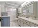 Well-lit bathroom features white tiling, updated fixtures and ample counter space at 2808 60Th W Ave # 1603, Bradenton, FL 34207