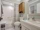 Bright bathroom with a vanity, mirror, toilet, built-in cabinet, and tiled shower-tub combination at 2808 60Th W Ave # 1603, Bradenton, FL 34207