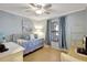 Bright guest bedroom with a cozy daybed, neutral walls, wood floors and decor at 2808 60Th W Ave # 1603, Bradenton, FL 34207