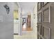 Inviting foyer leading into the living spaces with wood floors and a glimpse of natural light at 2808 60Th W Ave # 1603, Bradenton, FL 34207