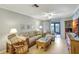 Cozy living room with comfortable seating, natural light and access to the outdoors at 2808 60Th W Ave # 1603, Bradenton, FL 34207
