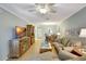Spacious open concept living space with ceiling fan, neutral paint and wood floors at 2808 60Th W Ave # 1603, Bradenton, FL 34207