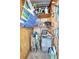 A well-organized storage area filled with beach chairs, cleaning supplies, and other household items on wooden shelves at 2808 60Th W Ave # 1603, Bradenton, FL 34207
