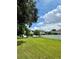 Expansive backyard with lush lawn and pristine white fencing, perfect for outdoor activities and privacy at 2904 N Ola Ave, Tampa, FL 33602