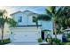 Charming two-story home with a well-maintained lawn, lush landscaping and two car garage at 2904 N Ola Ave, Tampa, FL 33602