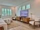 Bright living room with shiplap accent wall, and a large TV for entertainment at 2904 N Ola Ave, Tampa, FL 33602