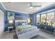 Inviting bedroom filled with natural light highlighting a relaxing seating area and tranquil wall art at 3408 Brookridge Ln, Parrish, FL 34219