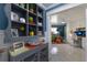 Hallway featuring decorative shelving, leading to a bright office space at 3408 Brookridge Ln, Parrish, FL 34219