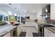 Spacious open concept kitchen features stainless steel appliances and a center island at 3408 Brookridge Ln, Parrish, FL 34219