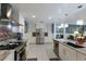 Bright and airy kitchen with stainless steel appliances, center island, and ample storage at 3408 Brookridge Ln, Parrish, FL 34219