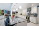 Bright kitchen features a large island with seating, modern appliances, and ample cabinet space at 3408 Brookridge Ln, Parrish, FL 34219