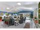 Spacious living room with modern decor, fireplace, and sliding doors leading to a pool for seamless indoor-outdoor living at 3408 Brookridge Ln, Parrish, FL 34219