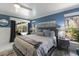 Comfortable main bedroom with pool views, stylish decor, and plenty of natural light at 3408 Brookridge Ln, Parrish, FL 34219