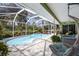 Sparkling pool with screen enclosure and lounge area, offering relaxation and entertainment in style at 3408 Brookridge Ln, Parrish, FL 34219