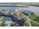 Aerial view shows waterfront neighborhood with canals, boat docks and beautiful landscaping at 3572 Peace River Dr, Punta Gorda, FL 33983