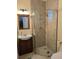 Contemporary bathroom featuring a glass shower, vanity, and modern fixtures at 3572 Peace River Dr, Punta Gorda, FL 33983