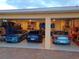 Three car garage showcases an organized space for vehicle parking and storage at 3572 Peace River Dr, Punta Gorda, FL 33983