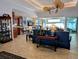 Open-concept living area with water views, tile floors, and elegant furnishings at 3572 Peace River Dr, Punta Gorda, FL 33983