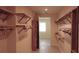Spacious walk-in closet with built-in shelving, offering ample storage space at 3572 Peace River Dr, Punta Gorda, FL 33983