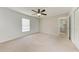 Bedroom featuring carpet, a ceiling fan, and a window at 3749 Albatros Ln, North Port, FL 34288