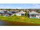 Aerial view of backyards, water, and neighboring homes at 3838 Manorwood Loop, Parrish, FL 34219