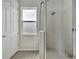Shower room with white tile and glass enclosure featuring an overhead shower head at 3838 Manorwood Loop, Parrish, FL 34219