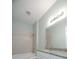 Bright bathroom featuring tile surround shower-tub combo, granite counters, and modern lighting at 3838 Manorwood Loop, Parrish, FL 34219