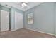 Bedroom with carpet, window, closet, and ceiling fan at 3838 Manorwood Loop, Parrish, FL 34219