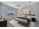 Serene bedroom featuring lake views, neutral decor, and a cozy, inviting atmosphere at 3838 Manorwood Loop, Parrish, FL 34219